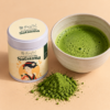 Honestea Satsuma matcha tin beside a bowl of freshly whisked matcha